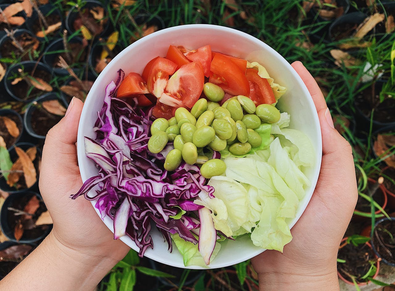 Green and Red Sliced Vegetables in White Ceramic Bowl